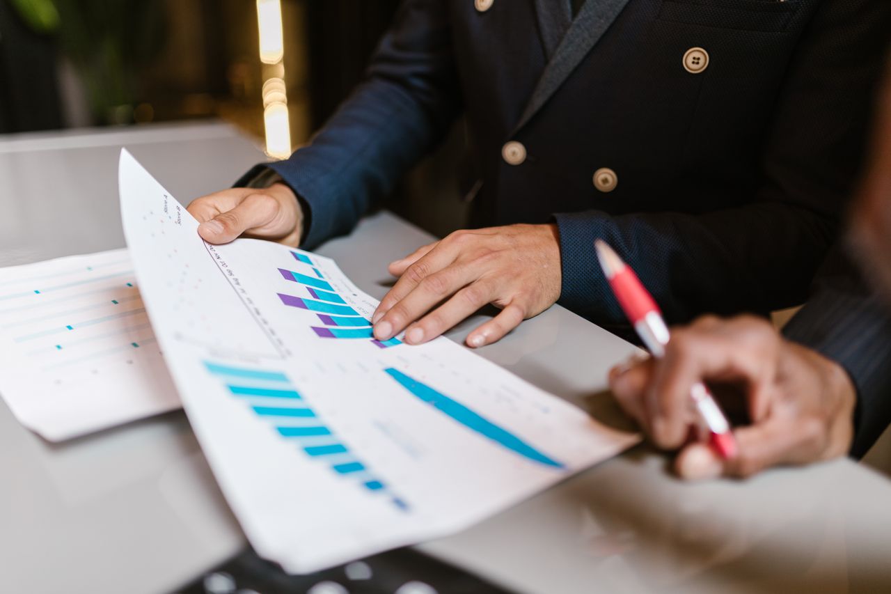 A marketing team reviewing campaign results on a screen